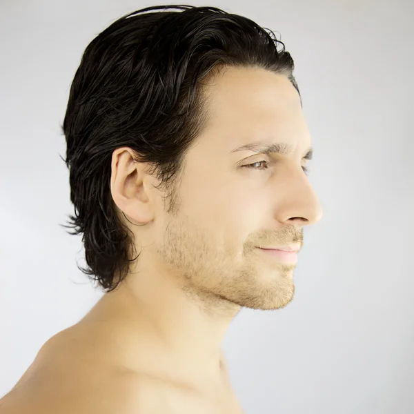 Profile of a handsome man smiling — Stock Photo, Image