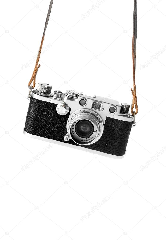 Vintage camera hanging in the straps