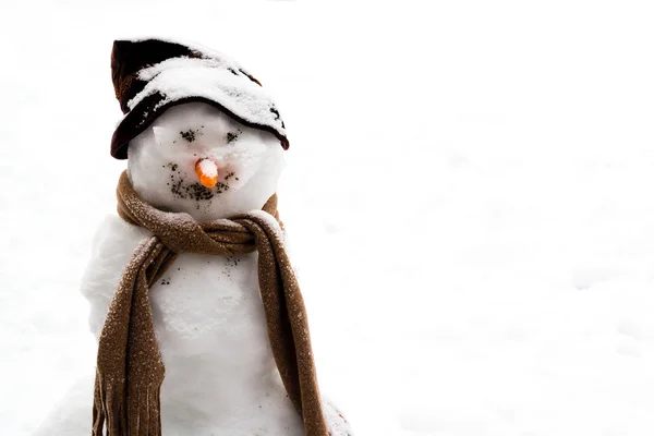 Smiling snowman in the snow — Stock Photo, Image