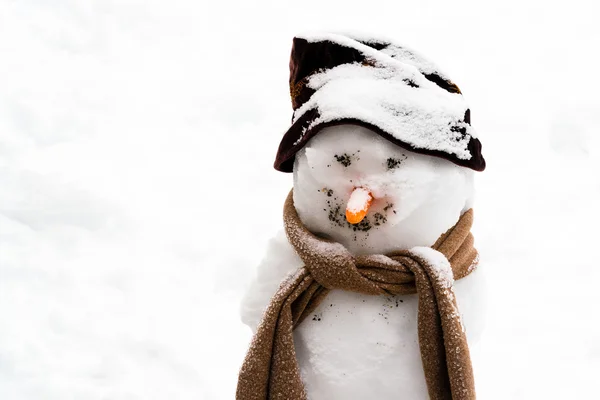 Smiling snowman in the snow — Stock Photo, Image