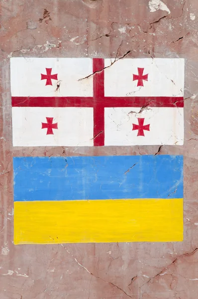 Ukraine and Georgian flag drawing on the stone symbol of friendship