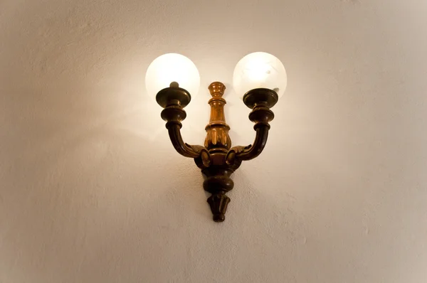 Antique wooden lamps on the wall in Vinci,italy