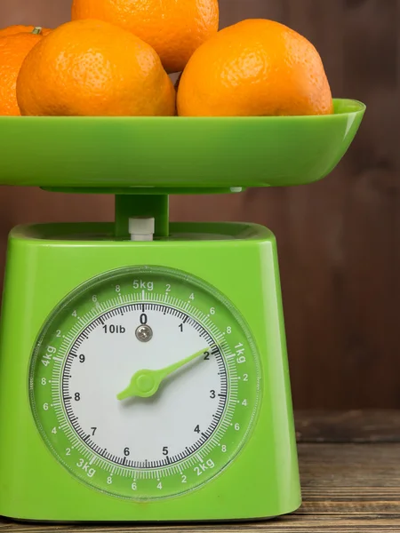 Fresh tangerine on the scales green