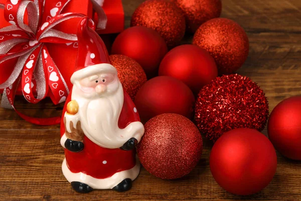 Ceramic Santa Red Christmas Baubles Present Boxes Wooden Background — Stock Photo, Image