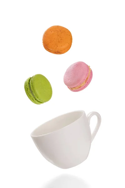 Colorful Macaroons Levitating White Tea Cup Isolation White Background — Stock Photo, Image