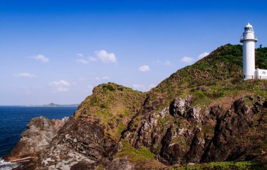 Big white lighthouse on Oganzaki cape. Attraction of Ishigaki island, Okinawa, Japan