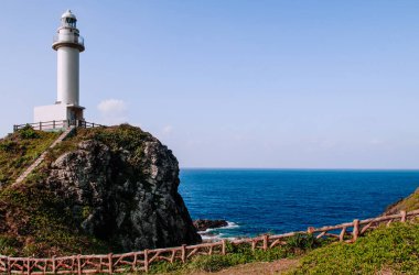 Big white lighthouse on Oganzaki cape. Attraction of Ishigaki island, Okinawa, Japan