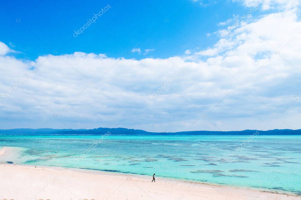 Tourist Kouri white sand beach with turqouise water on Kouri island, Naha, Okinawa, Japan