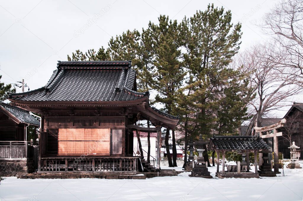 Vintage old Japanese shrine in winter snow, Sakata Sunkyo Soko, Yamagata orefecture, Japan