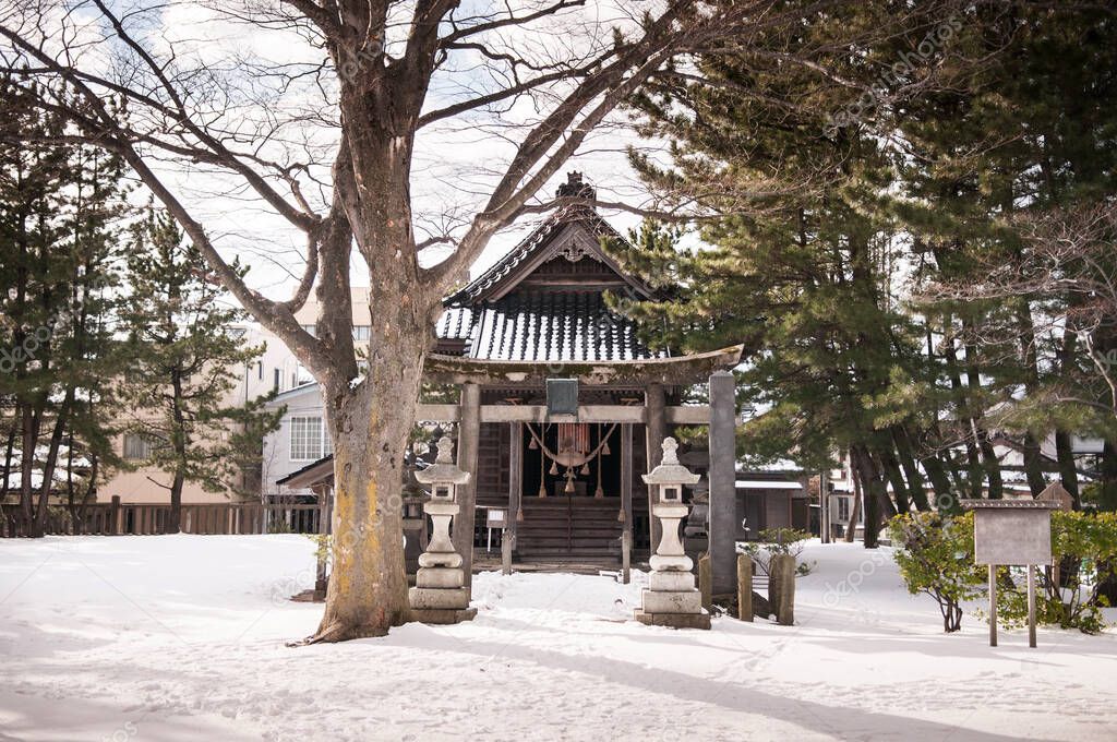 Vintage old Japanese shrine in winter snow, Sakata Sunkyo Soko, Yamagata orefecture, Japan
