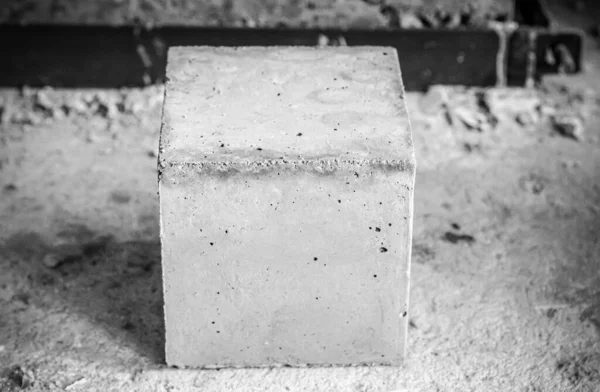 Square concrete block cubes for concrete strength testing process close up detail. black and white