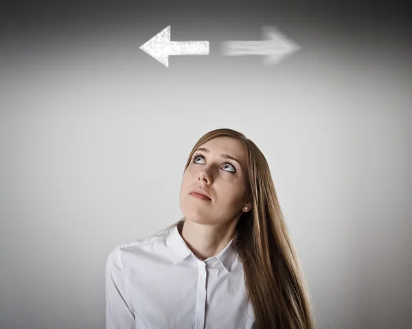 Woman in white and two arrows. — Stock Photo, Image