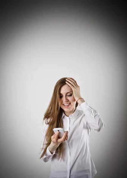 Woman in white with telephone — Stock Photo, Image