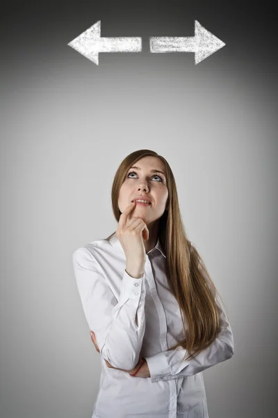 Woman in white and two arrows. — Stock Photo, Image