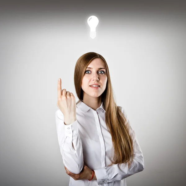 Pointing. Woman in white and IDEA — Stock Photo, Image