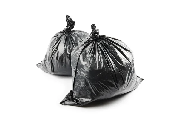 Два черных мешка для мусора — стоковое фото