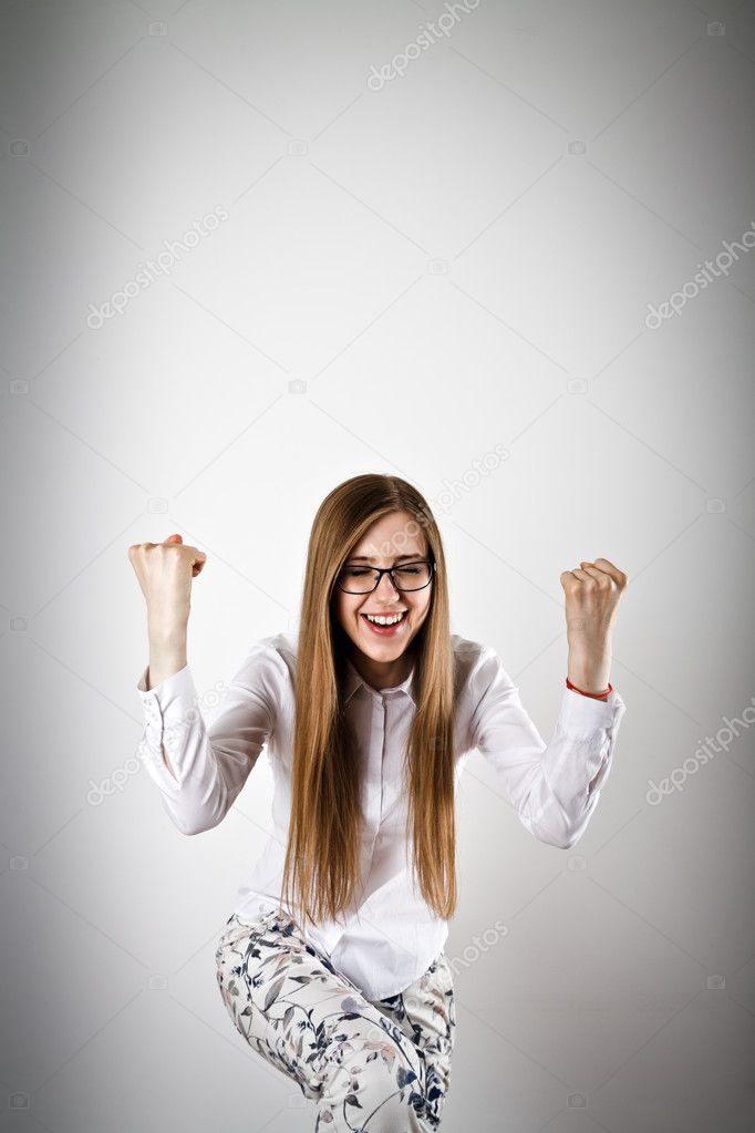 Rejoicing young woman in white
