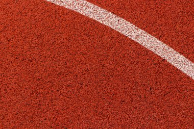 Basketbol sahası çizgileri. Üstten kahverengi alana beyaz çizgili kauçuk zemin.