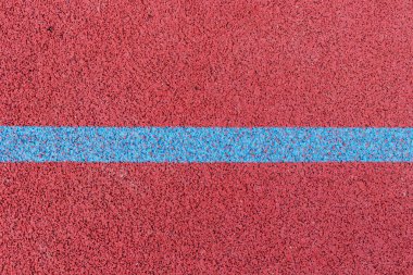 Basketbol sahası çizgileri. Üstten kahverengi alana beyaz çizgili kauçuk zemin.