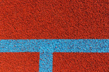 Basketbol sahası çizgileri. Üstten kahverengi alana beyaz çizgili kauçuk zemin.