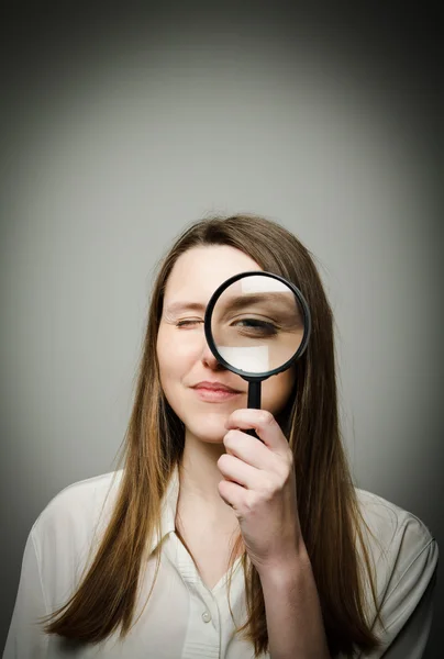 Woman with magnifier — Stock Photo, Image