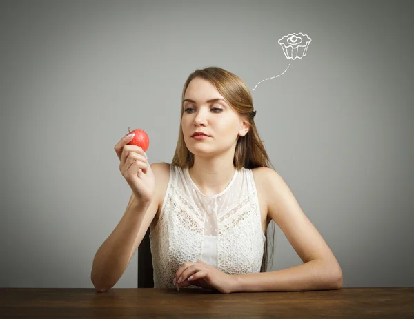 Girl in white and apple Stock Picture
