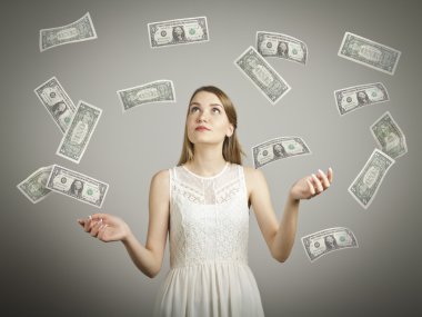 Girl in white and dollars. clipart