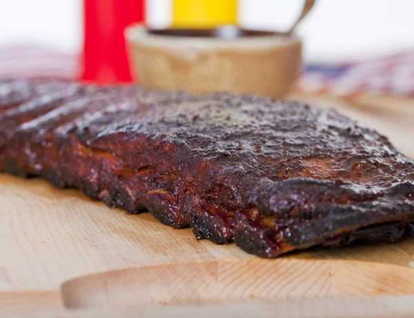 Fresh BBQ ribs on a wooden  board — Stock Photo, Image