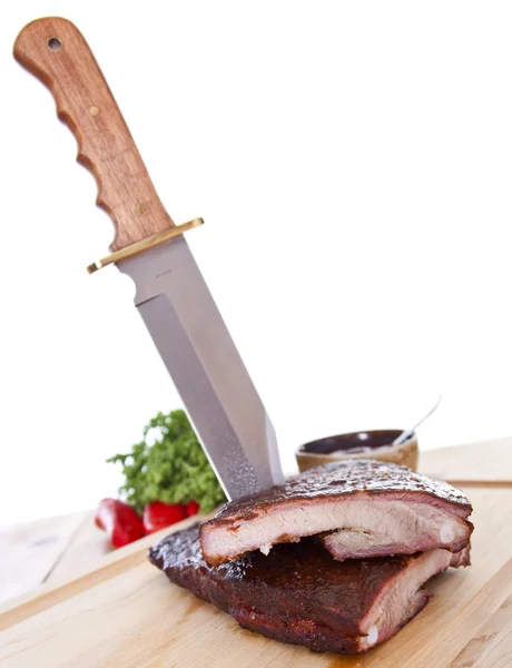 Fresh BBQ ribs on a wooden board — Stock Photo, Image