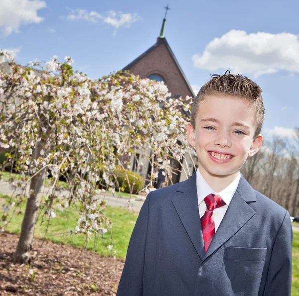 Boy outside of church — Stock Photo, Image