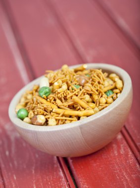 bombay mix in a wooden bowl clipart