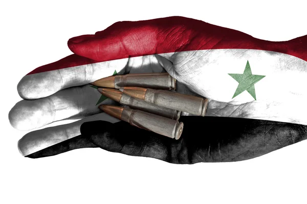 Adult hand with Iraq flag overlaid holding bullets. Isolated on white — Stock Photo, Image