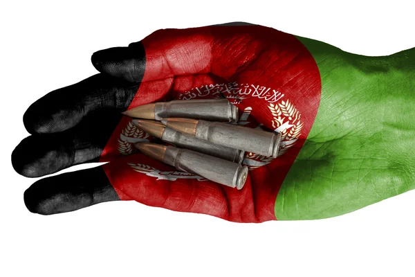 Adult hand with Afghanistan flag overlaid holding bullets. Isolated on white — Stock Photo, Image