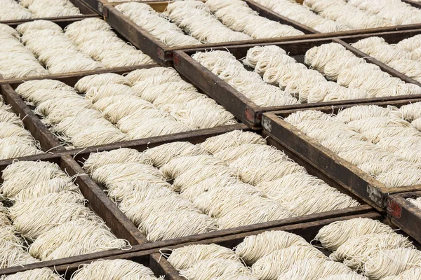 View on white noodles drying — Stock Photo, Image