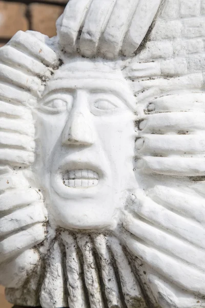 Statue of man's face with gritted teeth — Stock Photo, Image