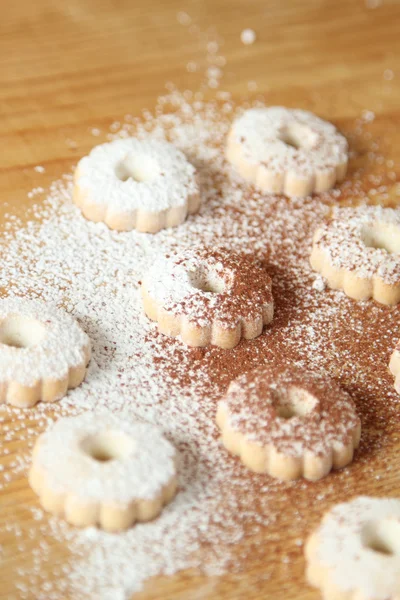 Italian canestrelli biscuits sprinkled with powdered sugar and cocoa