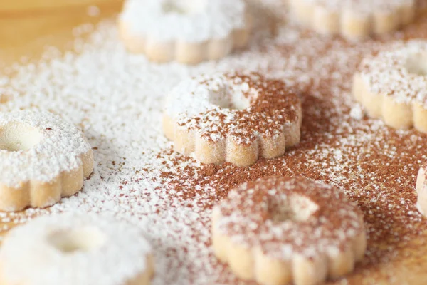 Italian canestrelli biscuits covered with powdered sugar and cocoa — Stock Photo, Image