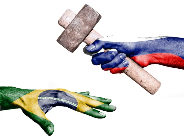 Russia hitting Brazil with a heavy hammer — ストック写真