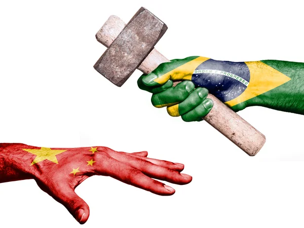 Brazil hitting China with a heavy hammer — ストック写真