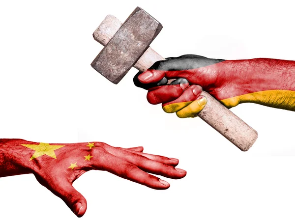Germany hitting China with a heavy hammer — Stock Photo, Image