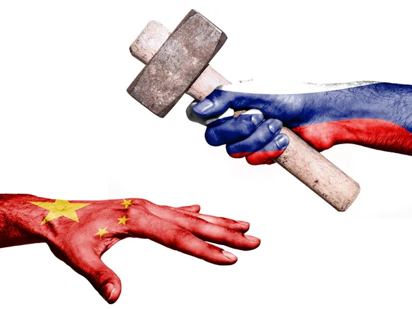 Russia hitting China with a heavy hammer — Stock Photo, Image