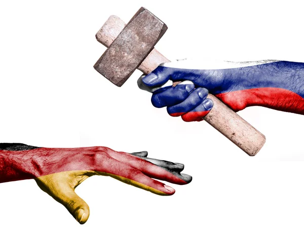 Russia hitting Germany with a heavy hammer — Stock Photo, Image