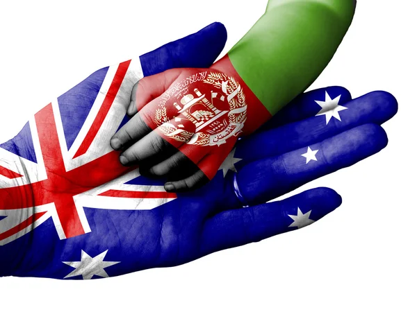 Adult man holding a baby hand with Australia and Afghanistan flags overlaid. Isolated on white — Stock Photo, Image