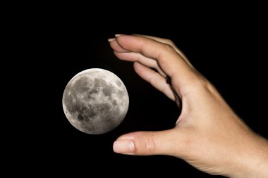 Hand catching the moon clipart