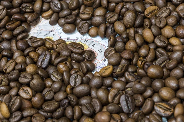 Map of Vietnam under a background of coffee beans — Stockfoto