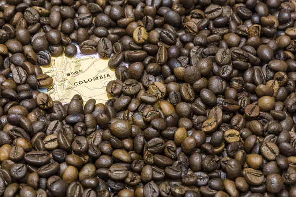 Map of Colombia under a background of coffee beans