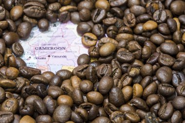 Map of Cameroon under a background of coffee beans
