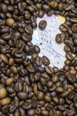 Map of Peru under a background of coffee beans