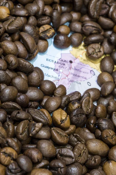 Map of Ecuador under a background of coffee beans — Stockfoto