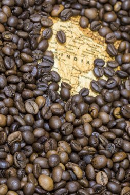 Map of India under a background of coffee beans